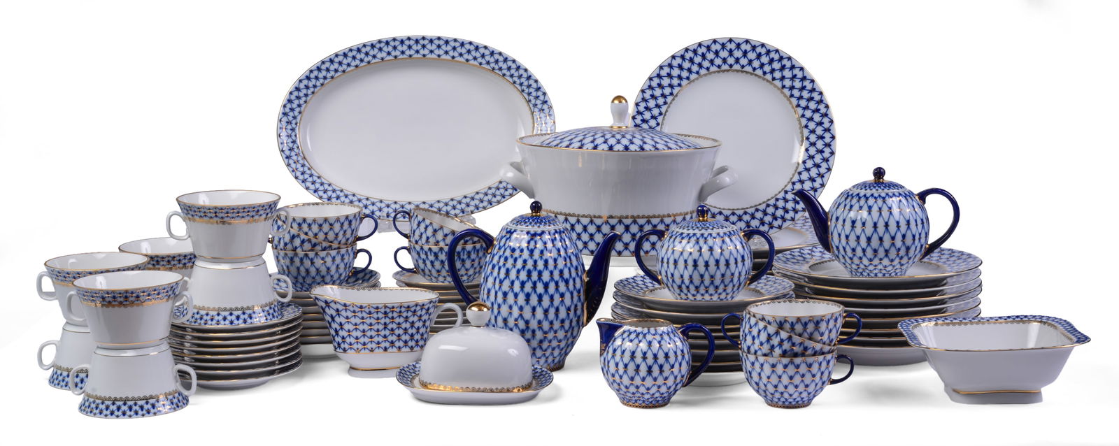 Lomonosov Imperial Porcelain Dinner Service: 8 dinner plates, 8 salad plates, 8 dessert plates, 8 bread plates, 16 cups and saucers, covered dish, and two trays. Good condition, some minor scratches and wear.