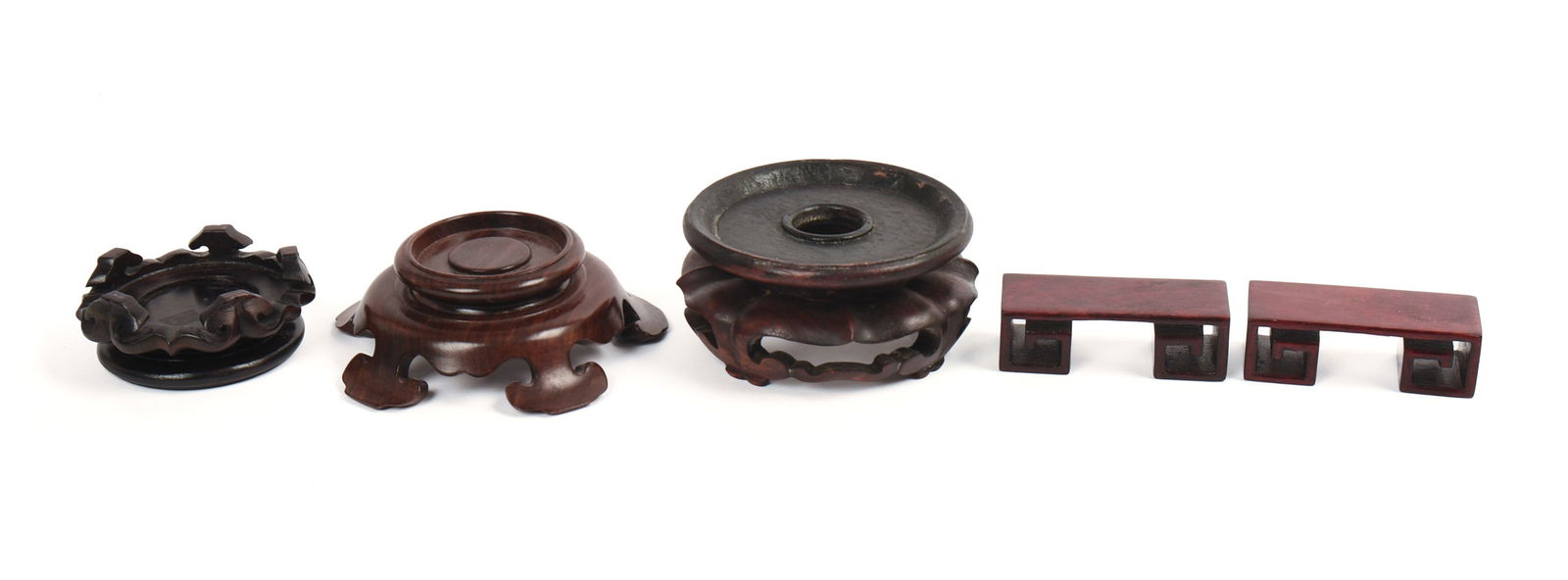 FIVE CHINESE CARVED WOODEN DISPLAY STANDS. (1 of 4)