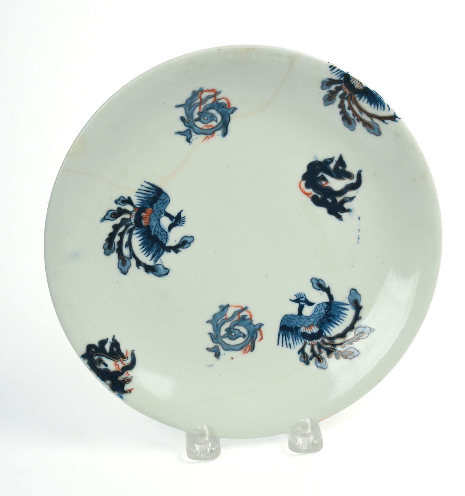 JAPANESE ARITA PORCELAIN DRAGON AND PHOENIX PLATE.: 18/19th century. Diameter 8.625 inches. Light stain lines.