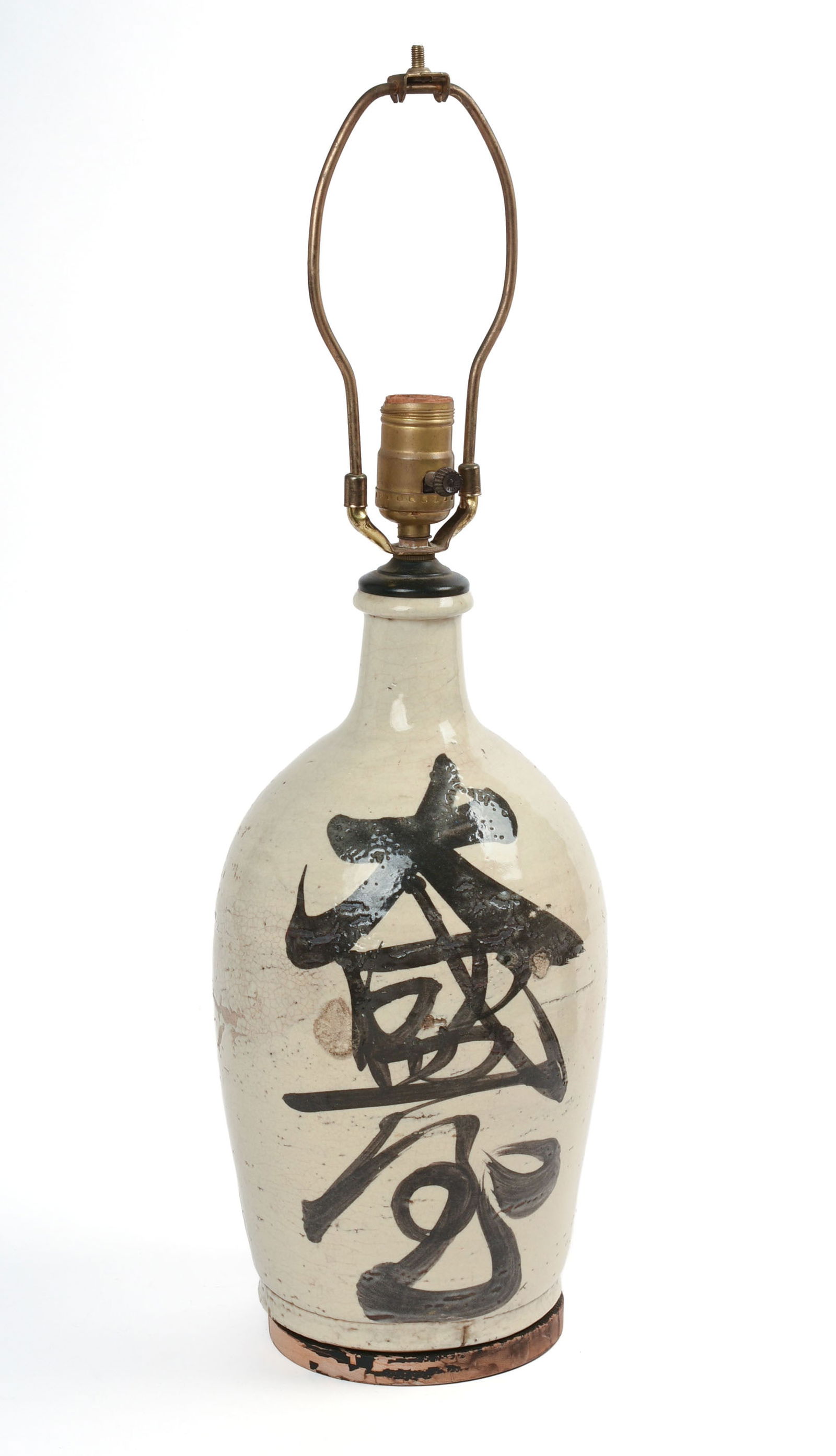 JAPANESE SAKE BOTTLE LAMP.: The bottle 19th century. Height 14 inches. Overall height 23 inches.
