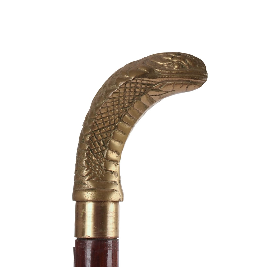 19TH CENTURY CANE WITH COBRA HANDLE.: In three sections, height 36 inches.