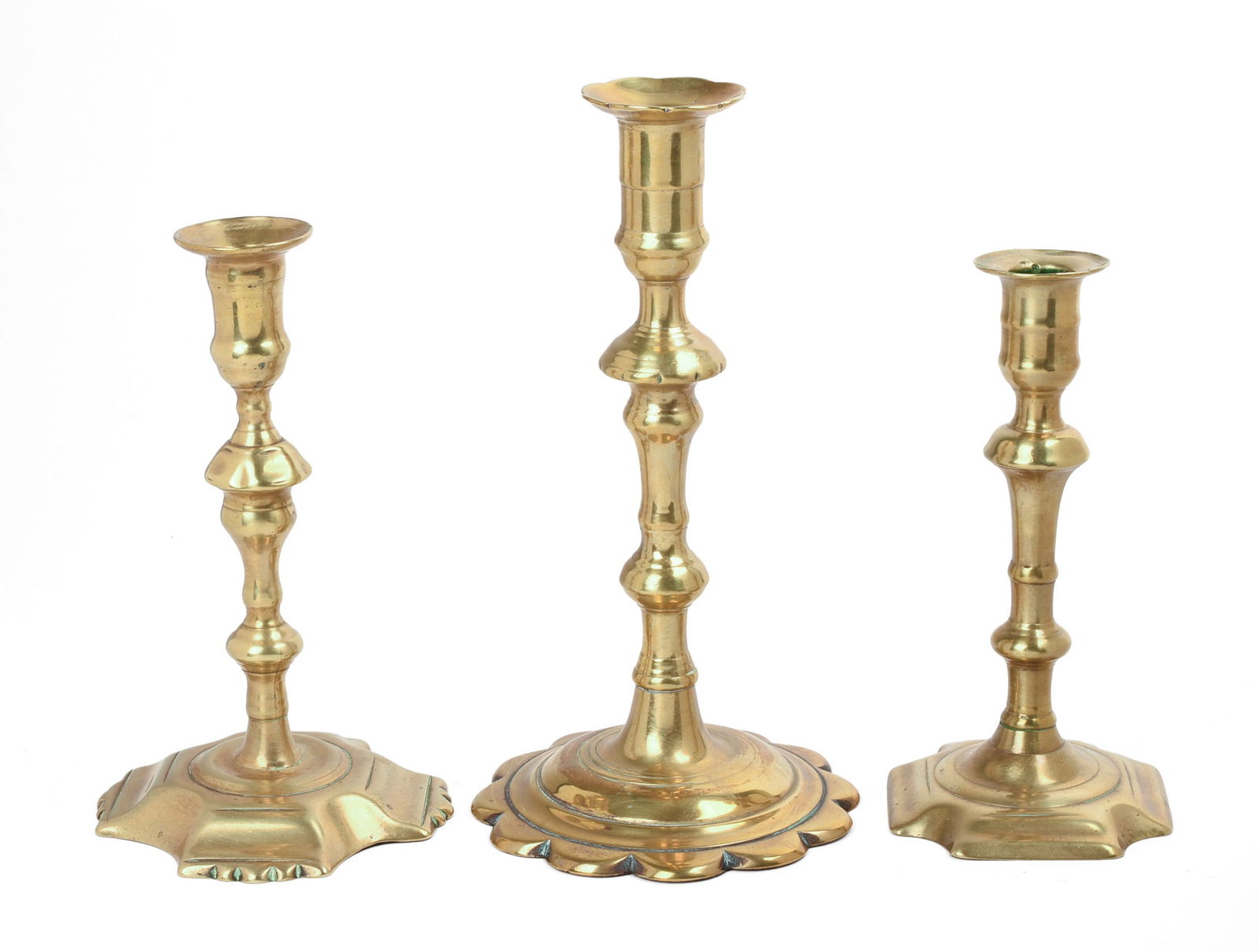 THREE 18TH CENTURY BRASS CANDLESTICKS. (1 of 2)