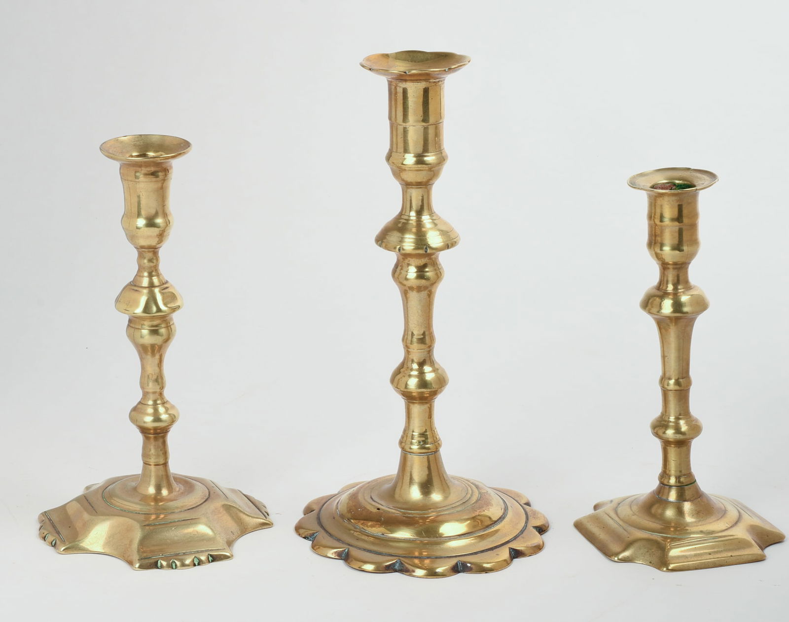 THREE 18TH CENTURY BRASS CANDLESTICKS. - 2