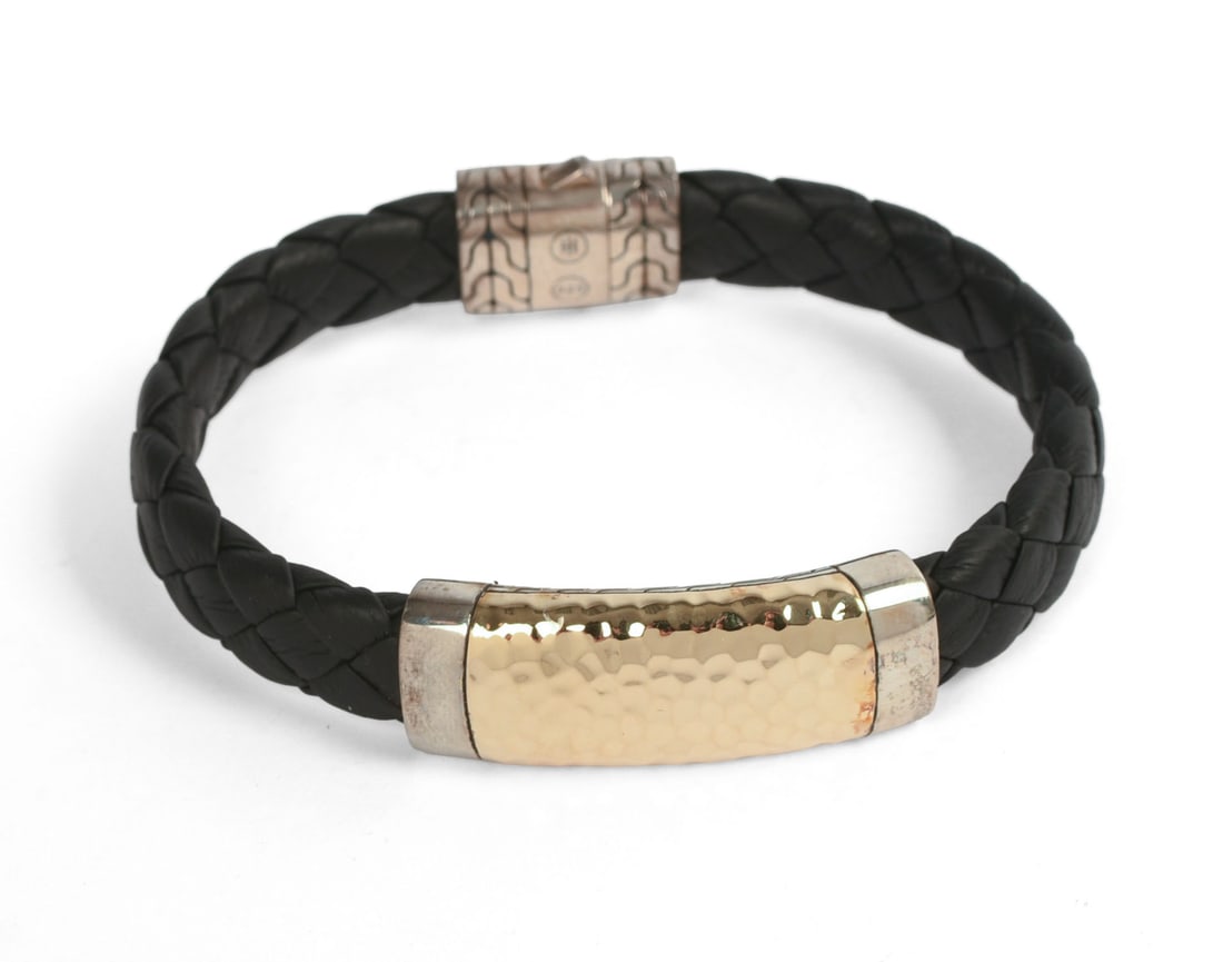 JOHN HARDY HAMMERED GOLD AND SILVER BRACELET.: Inside diameter 2.5 inches, opens to accommodate wrist. 29.45 grams. Retail price $1,295.