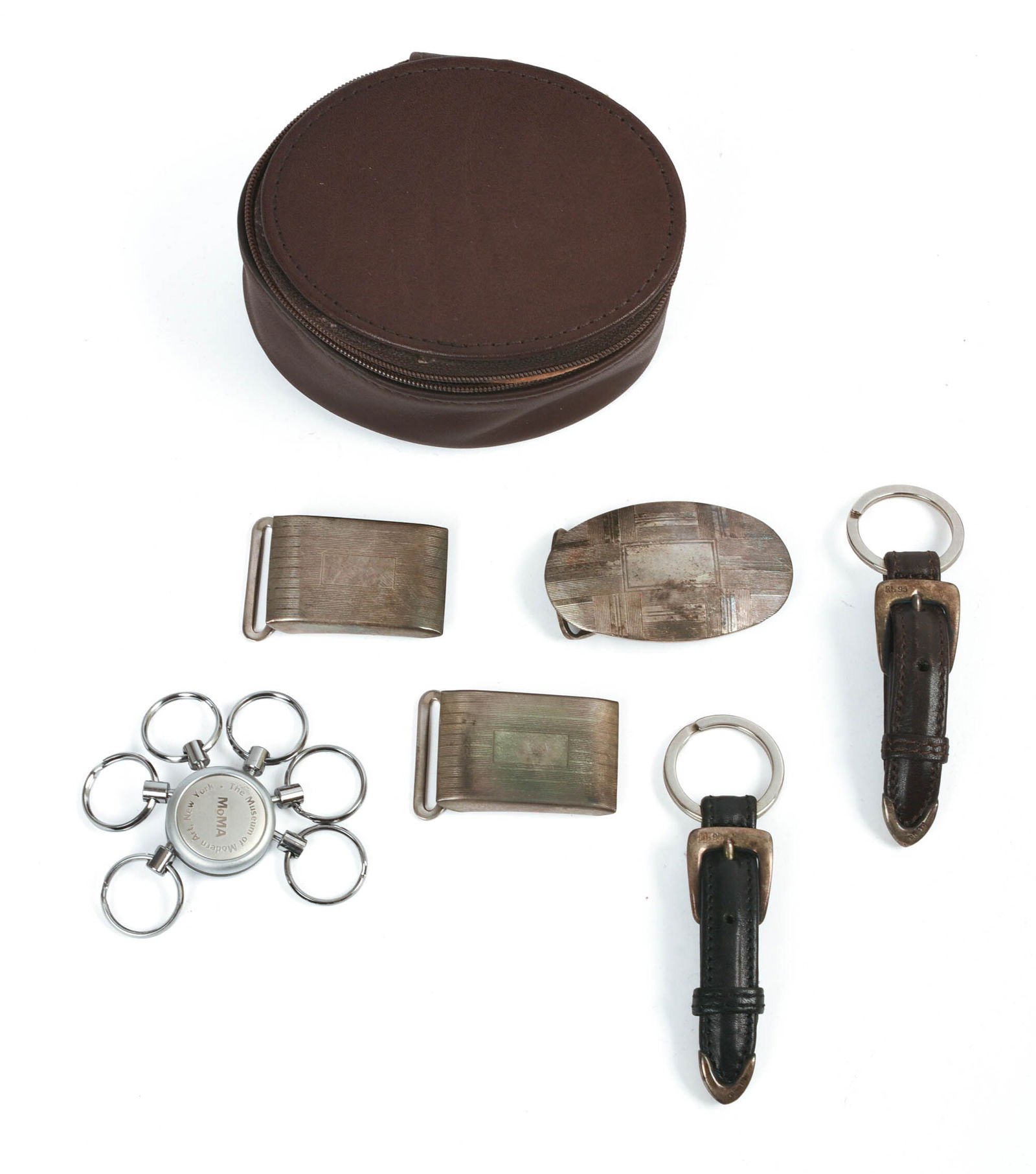 THREE POLO RALPH LAUREN STERLING BELT BUCKLES.: 1.5 x 1 and 2.25 x 1.25 inches, 71 grams. Together with three keychains.