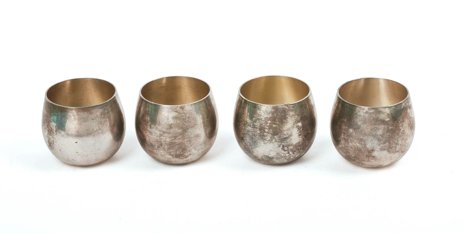 FOUR TIFFANY & CO. STERLING SHOT GLASSES.: Height 1.25 inches, 112 grams.