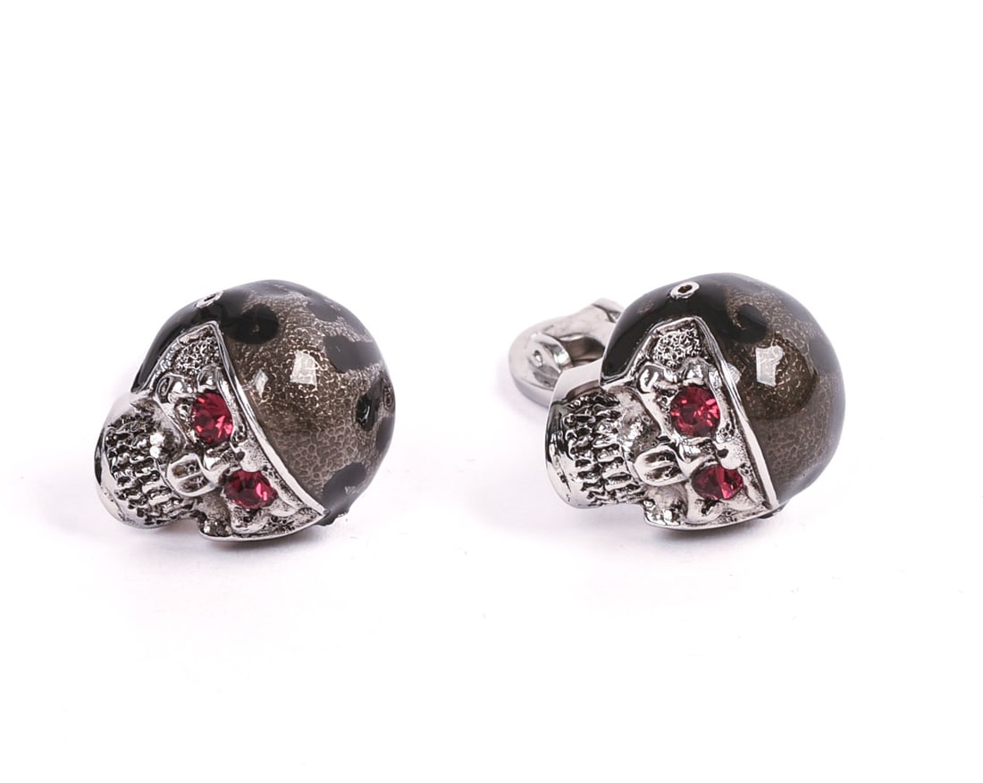 JAN LESLIE STERLING SILVER FOOTBALL SKULL CUFFLINKS.: New in bag.
