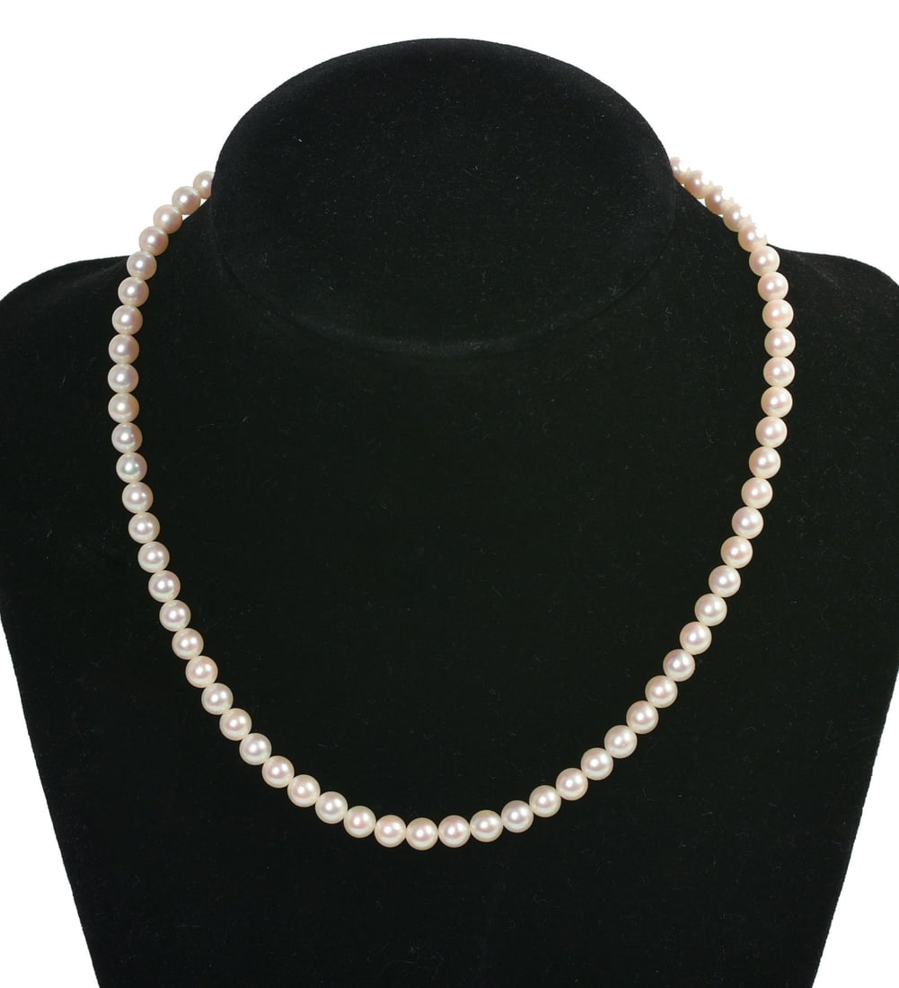STRAND OF MIKIMOTO CULTURED PEARLS.: Mikimoto mark, sterling clasp. Length 13 inches.