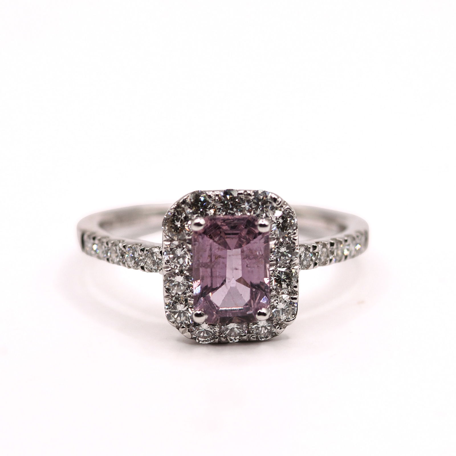 PLATINUM NATURAL UNHEATED PINK SAPPHIRE CORUNDUM AND DIAMOND RING: Octagonal step, faceted cut, pink sapphire corundum centerstone, 1.32 CT. Round brilliant cut diamond accent stones. 0.63 CT, 24 pieces. Gross total weight 3.5 Grams. Size 6.75.
