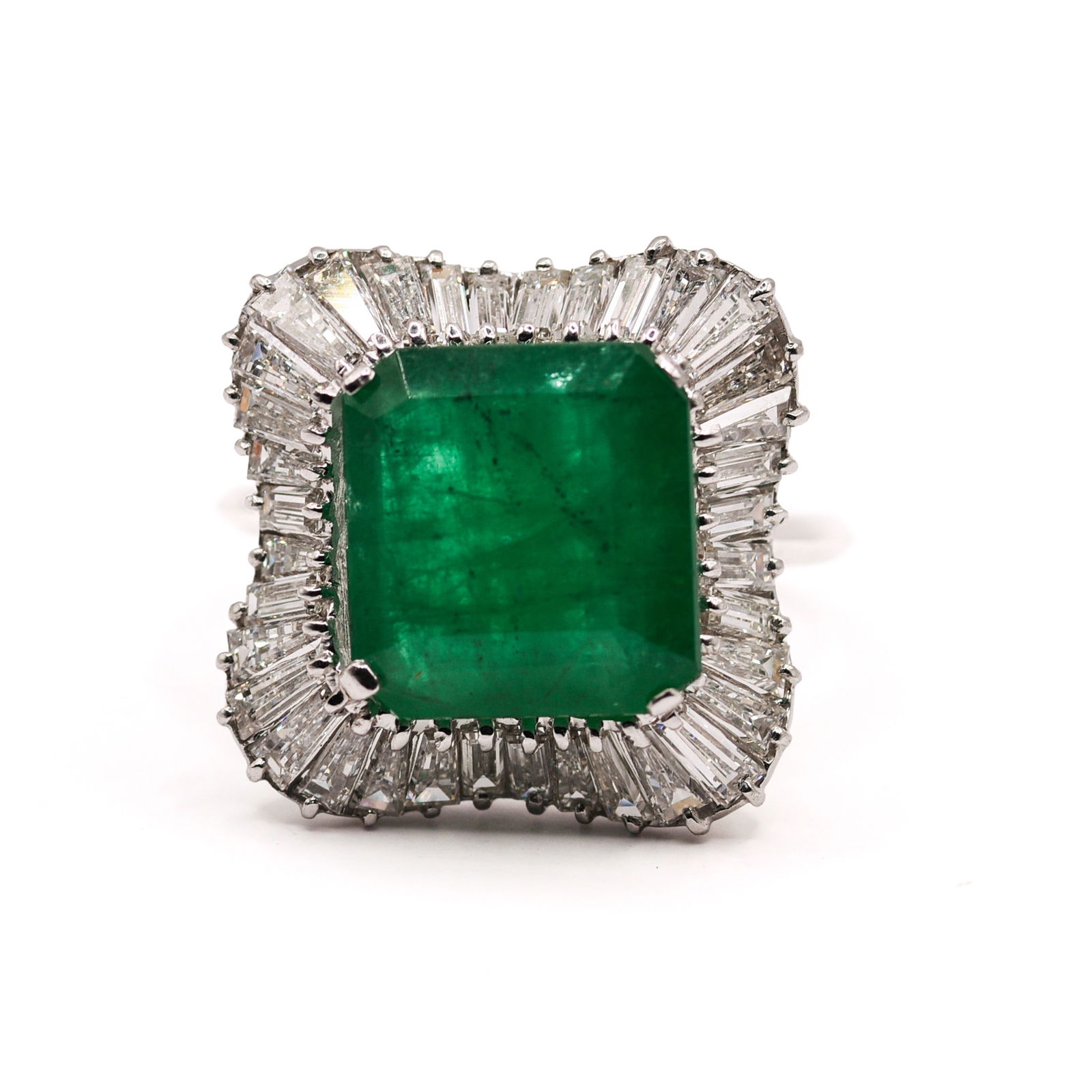 18K WHITE GOLD EMERALD AND DIAMOND RING: Octagonal step cut, rare minor oil, natural beryl emerald centerstone, 5.53 CT. Baguette natural diamond accent stones. 2.25 CT, 36 pieces. Gross total weight 6.3 Grams. Size 6.25.