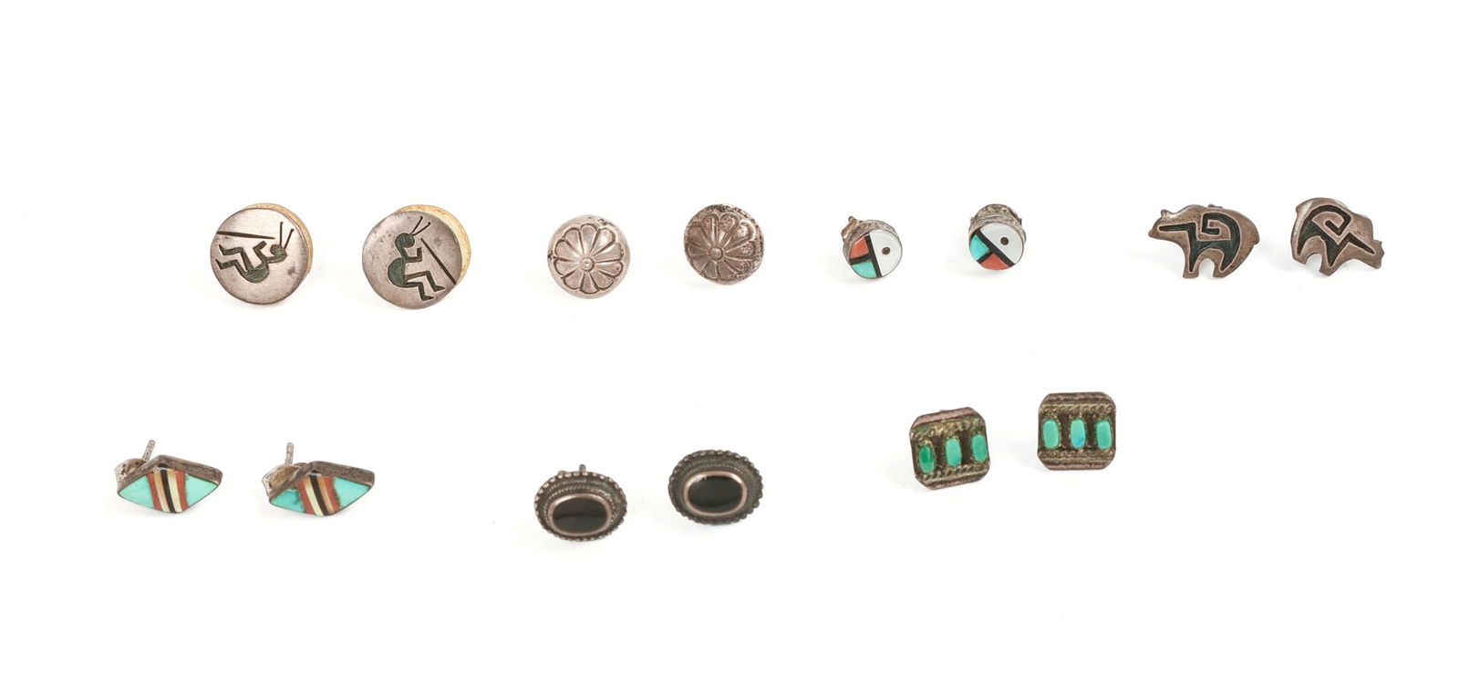 Seven Pairs of Native American Silver Stud Earrings.: Diameter of largest 0.5 inches.