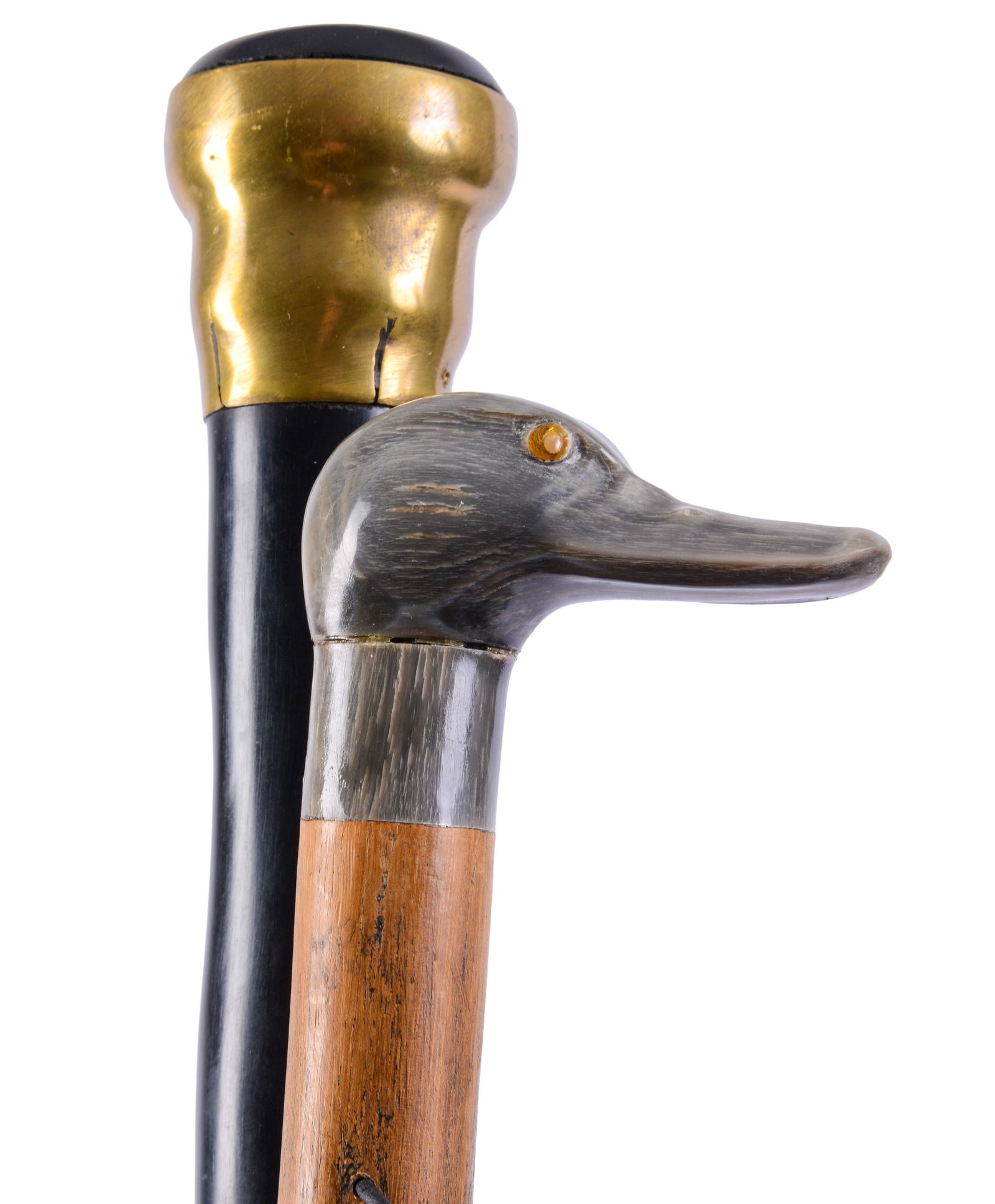 Two Nineteenth Century Canes.: One with duck handle, and one with whale, lengths 32 inches. Small loss to end of whale cane.