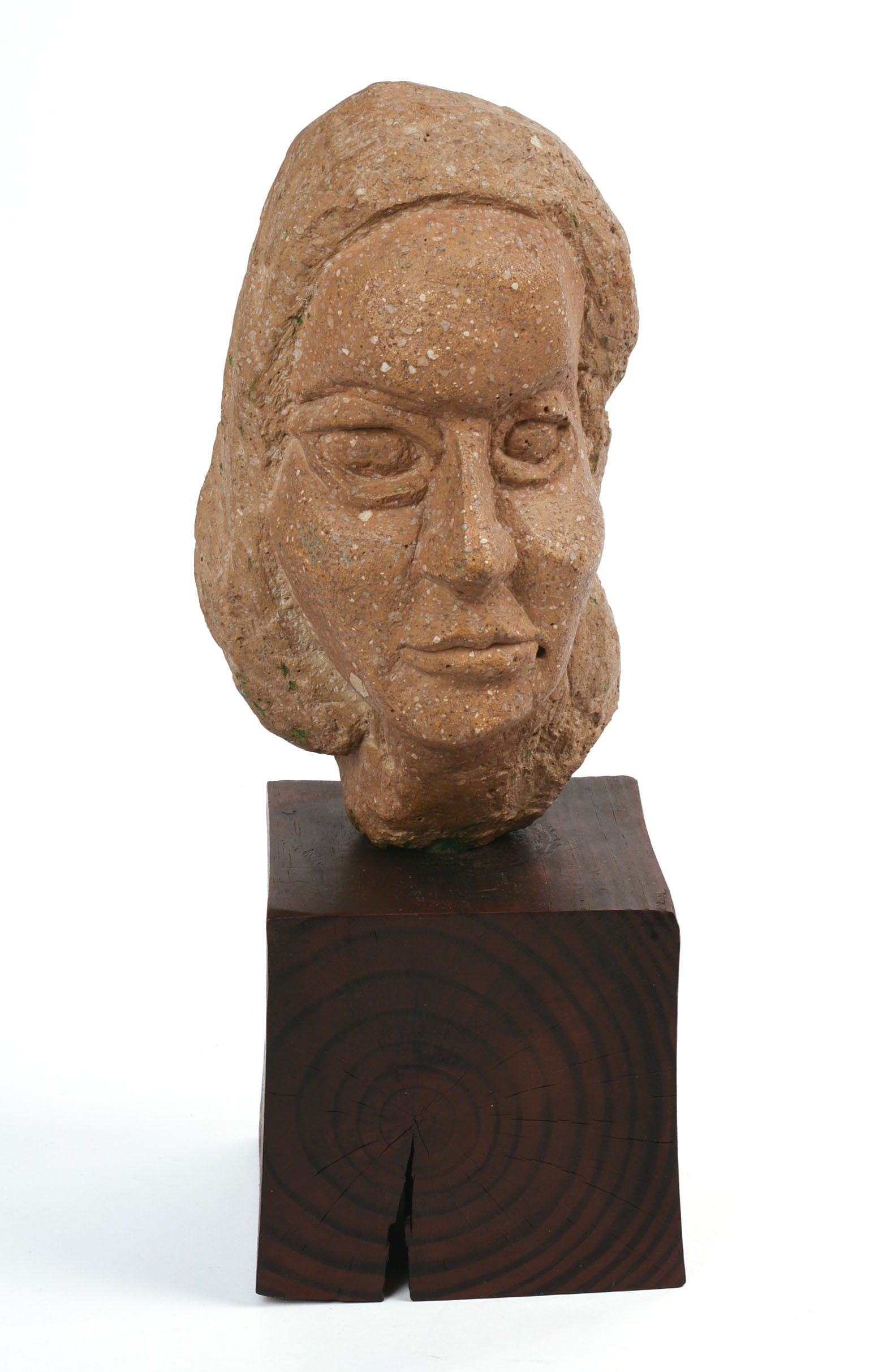 Folk Art Carved Head.: Carved of composite stone, 20th c., unsigned, mounted on wood base. Height including stand 16 inches.