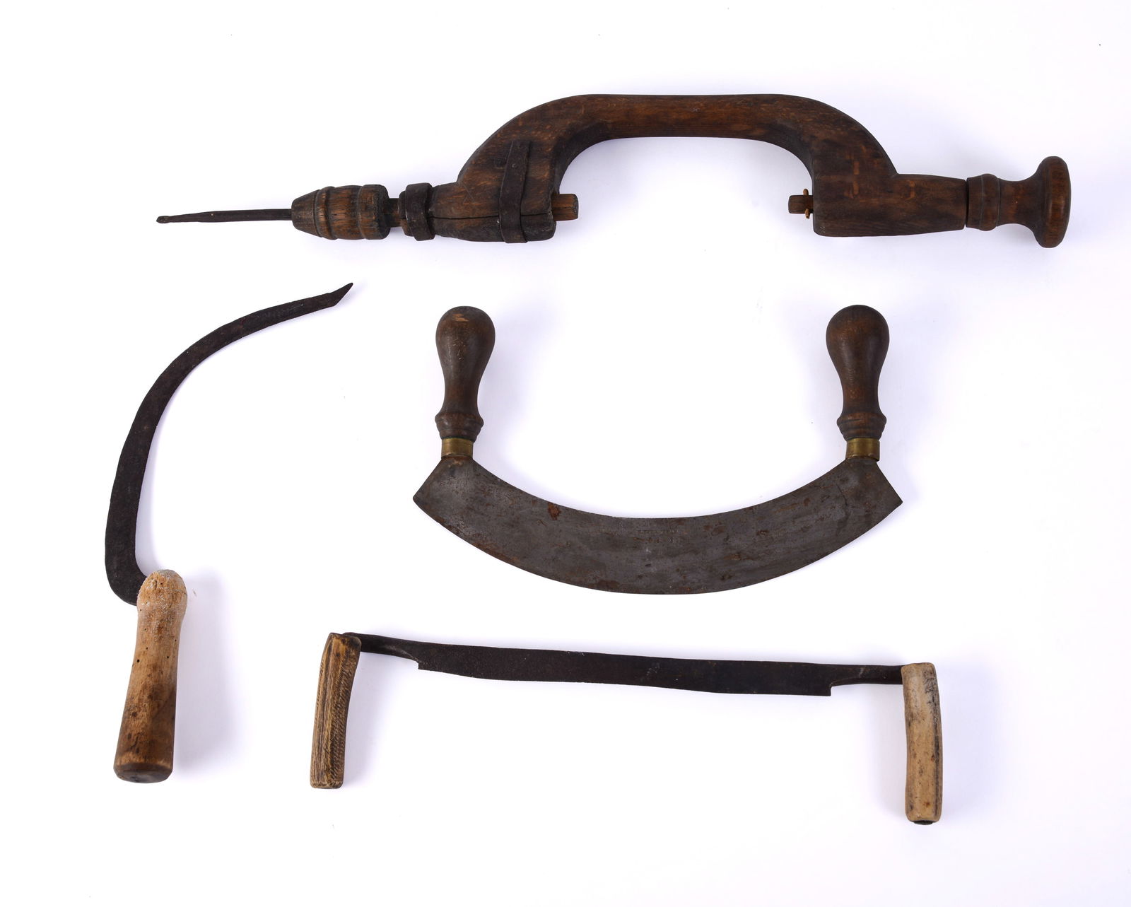 Four Antique Tools.: Early 19th century brace, length 24 inches, Civil War era blacksmith made sickle and drawknife, and an E.H Jernstad chopper.