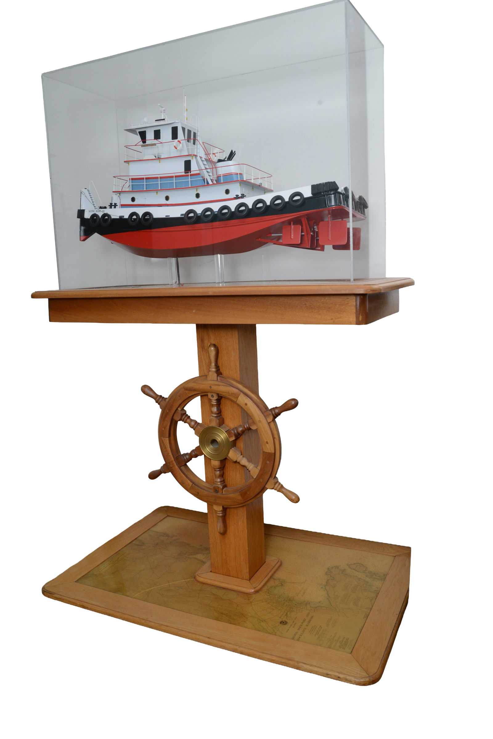 Work Boat 89 Model.: Length 32 inches. With custom display case and stand, height 65 inches, width 42 inches, depth 29 inches. Propellors detached, cracks to base.