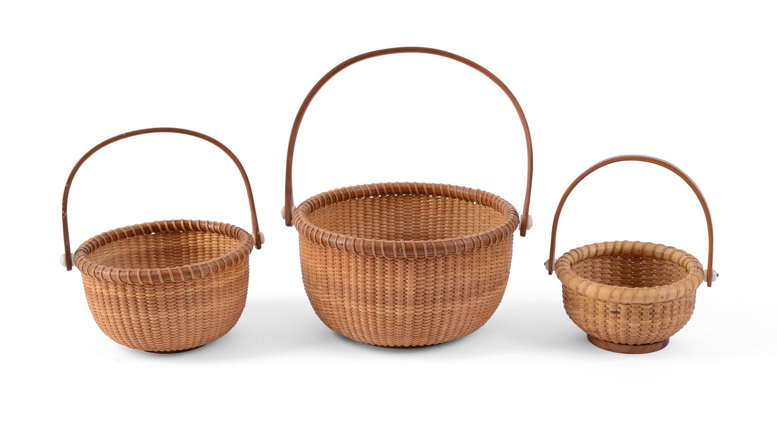 Three Nantucket Baskets.: Diameters 4.75, 5.25 and 7 inches. One signed Jan Finton, two signed J Hall. Good condition.