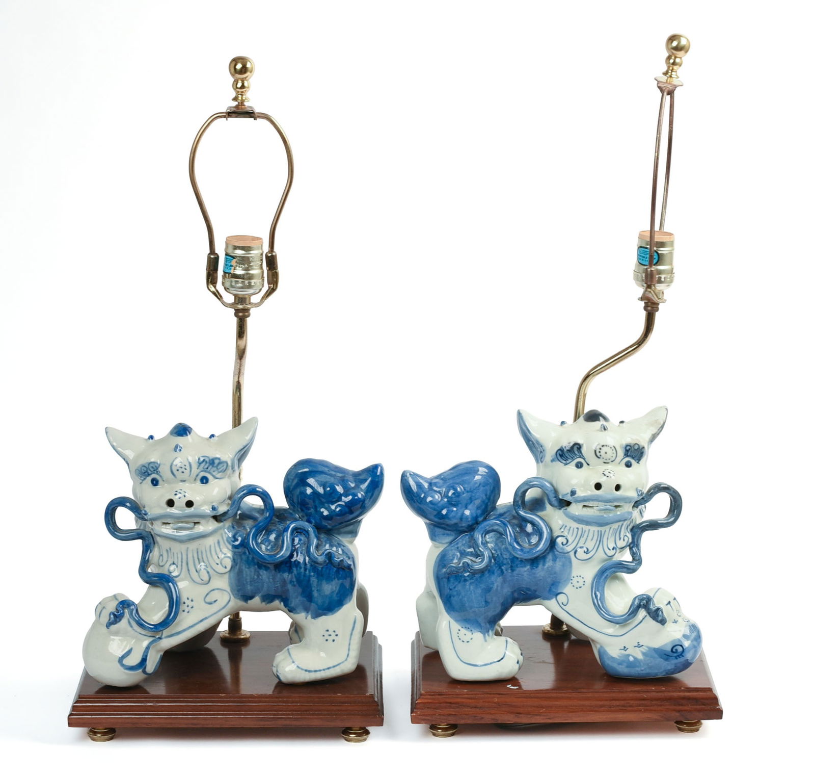 Pair of Chinese Porcelain Lions.: Length 9.5 inches, fitted as lamps.