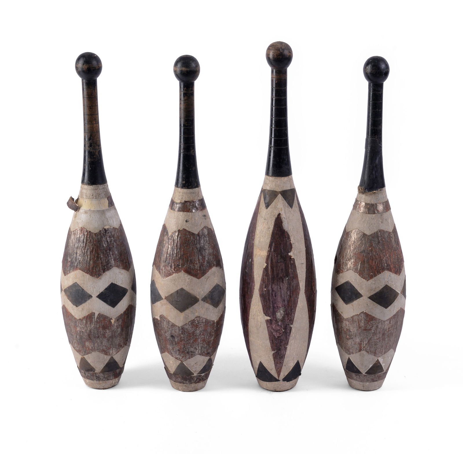 Four Antique Juggling Pins.: Length 20 inches. Some losses.