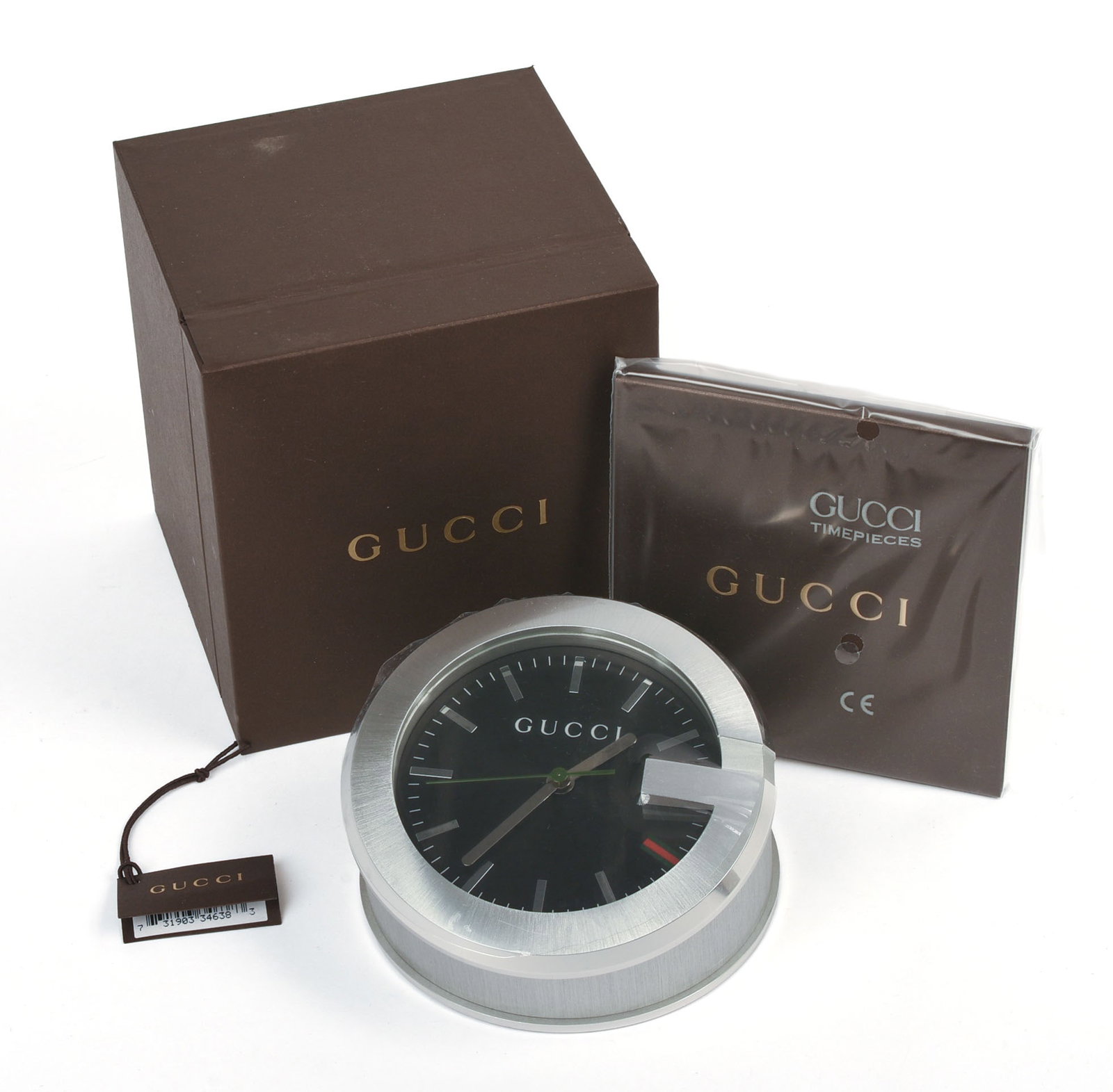 Gucci 210 Desk Clock.: Diameter 4 inches, new in box.