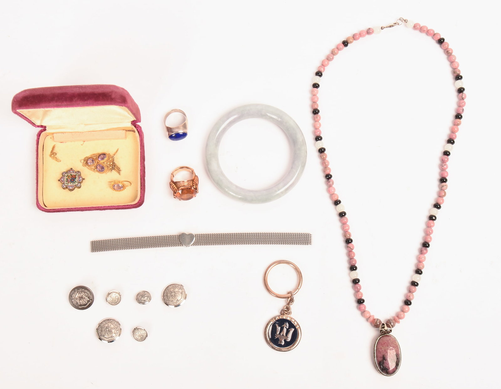 Group of Jewelry.: Necklace with sterling pendant (length 22 inches), two rings, Maserati keychain, jade bracelet, and others. From the collection of Jane Morgan.