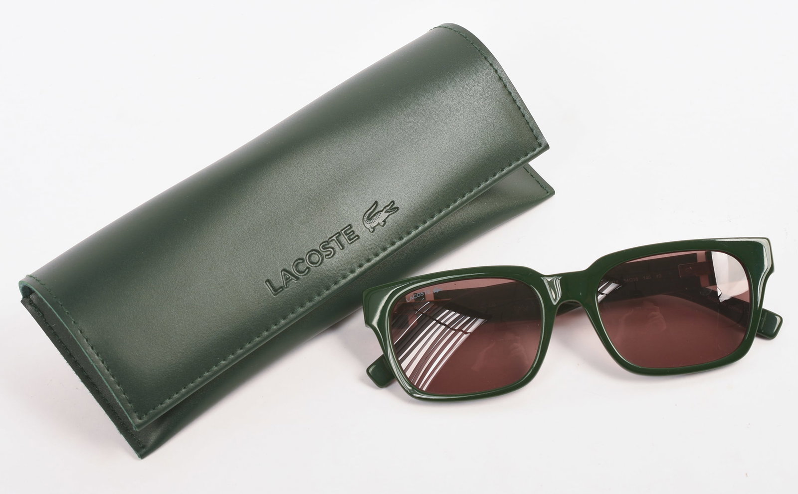 Lacoste Green Sunglasses.: With case, excellent condition.