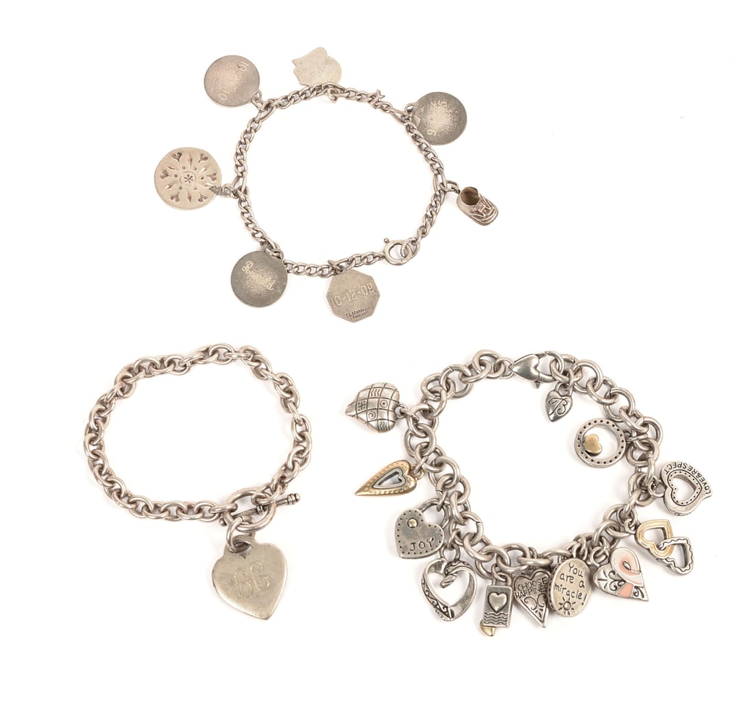 Three Sterling Charm Bracelets. (1 of 2)