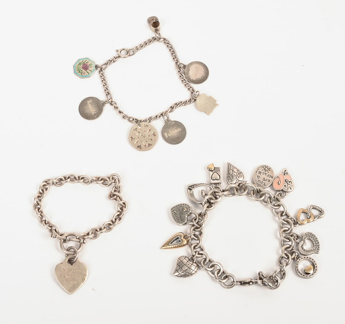 Three Sterling Charm Bracelets. - 2