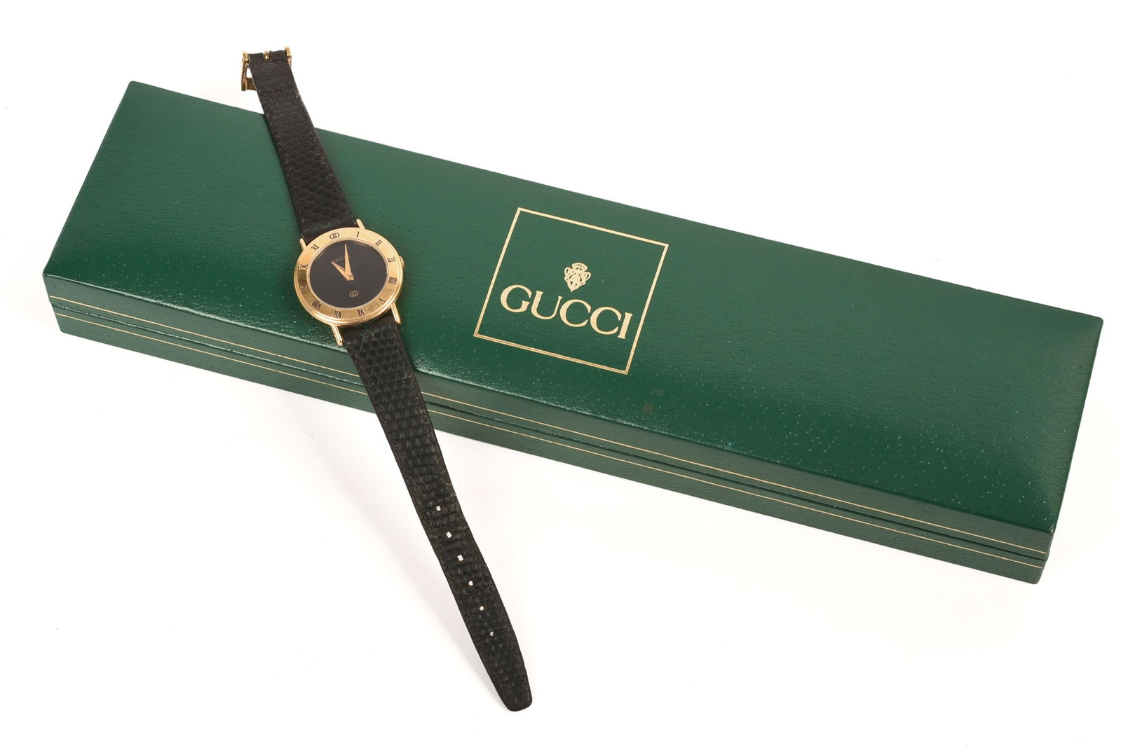 Gucci Ladies Watch.: Face diameter 1 inch, total length 7 inches. Some scratches, appears operational. Includes original box.