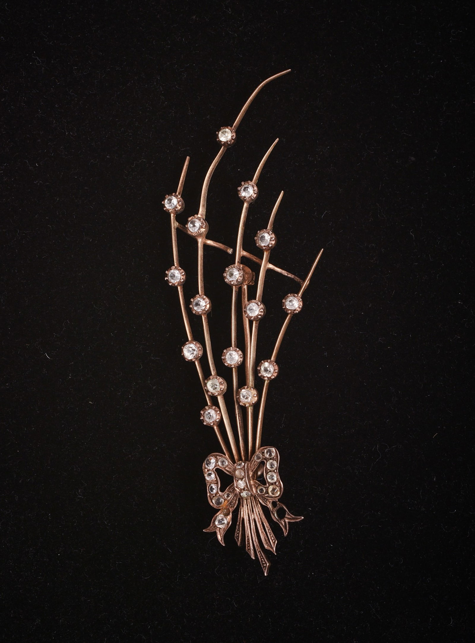 Vintage Diamond Brooch.: Length 4 inches. Indecipherable mark on top of one side of bow. Missing one stone, small break.