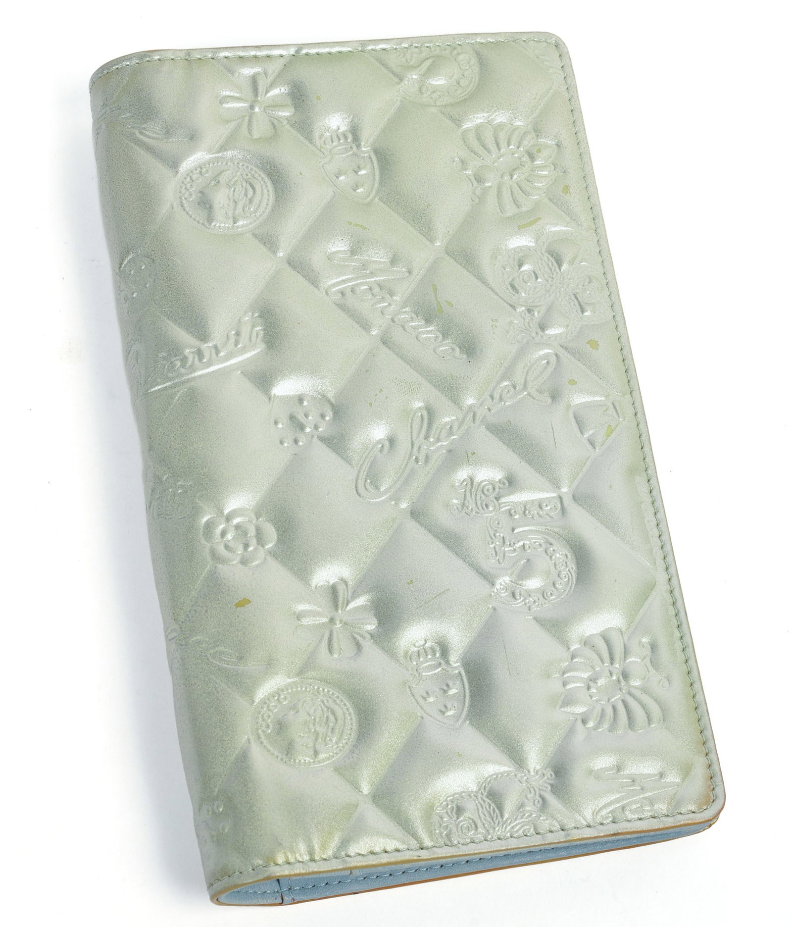Chanel Silver Embossed Wallet.: Blue interior, 7 x 4 inches.
