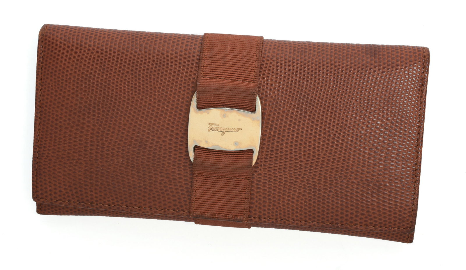 Ferragamo Brown Embossed Wallet.: 7.5 x 4 inches. Some wear.