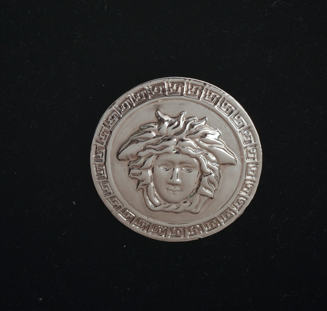 Versace Silver Tone Brooch.: Diameter 1.5 inches, with bag.