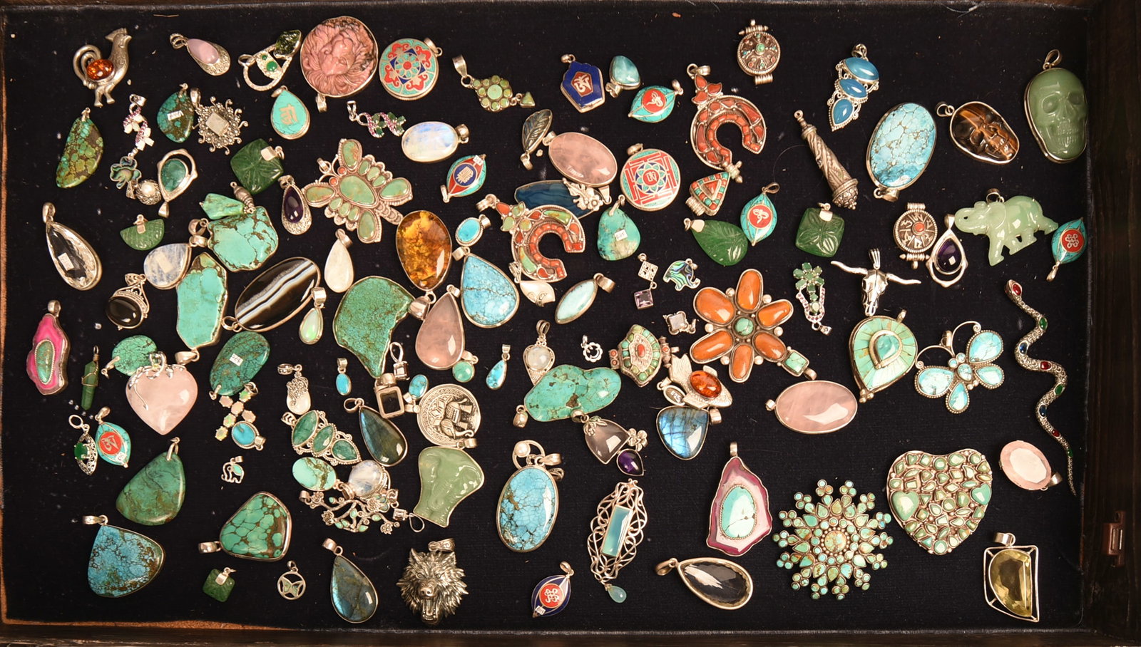 Large Collection of Turquoise and Other Pendants in a Display Case.: Case 24 x 14 x 3.5 inches.