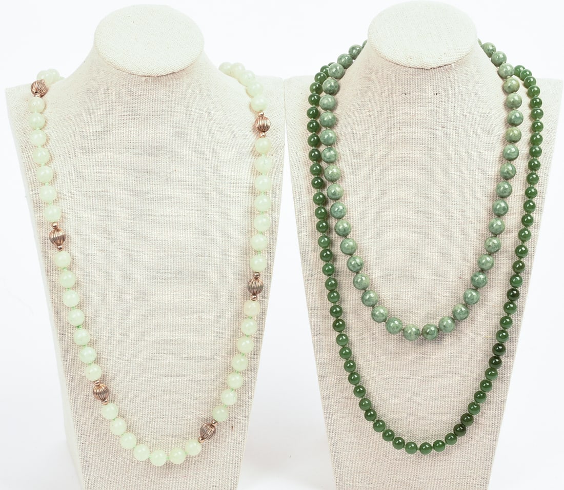 Three Jade Beaded Necklaces.: Lengths 18 and 28 inches. One display form included.