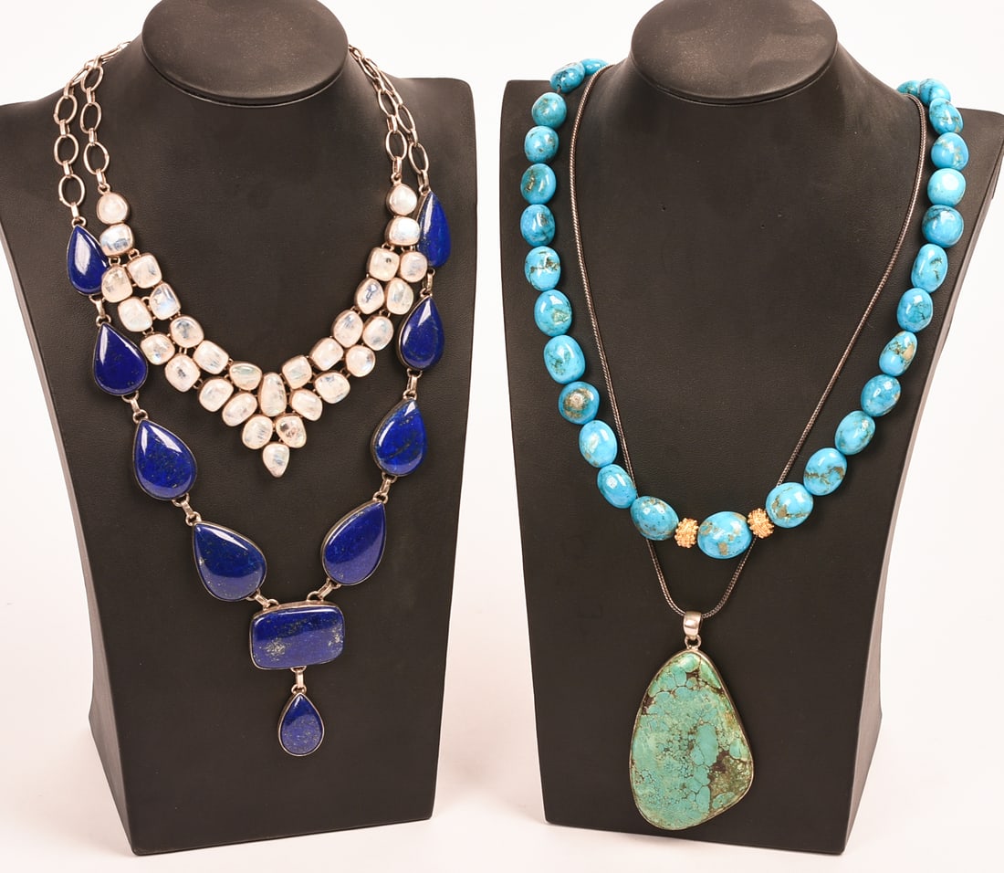 Two Turquoise, One Lapis, and One Moonstone Necklaces.: Length of turquoise pendant chain 20 inches. Displays included.