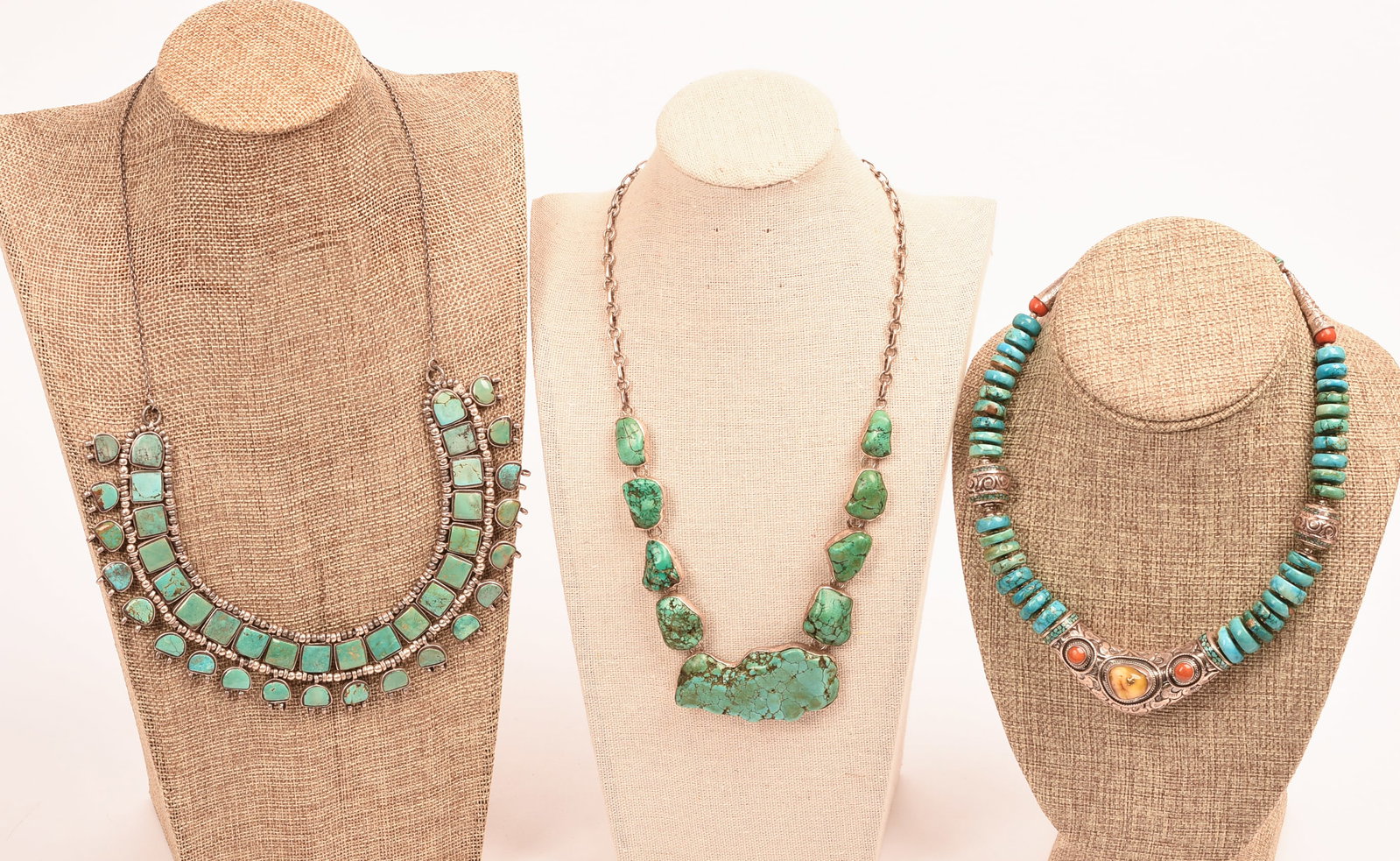 Three Turquoise Necklaces.: Length of longest 18 inches. One stand included.
