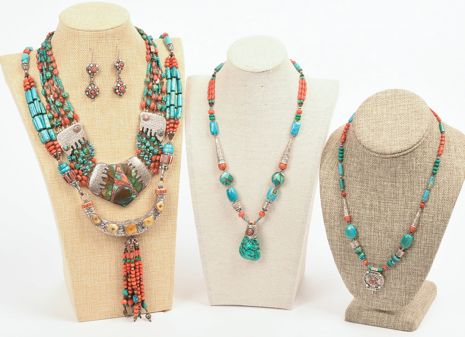 Four Turquoise Necklaces and a Pair of Earrings.: Length of longest 20 inches. One stand included.