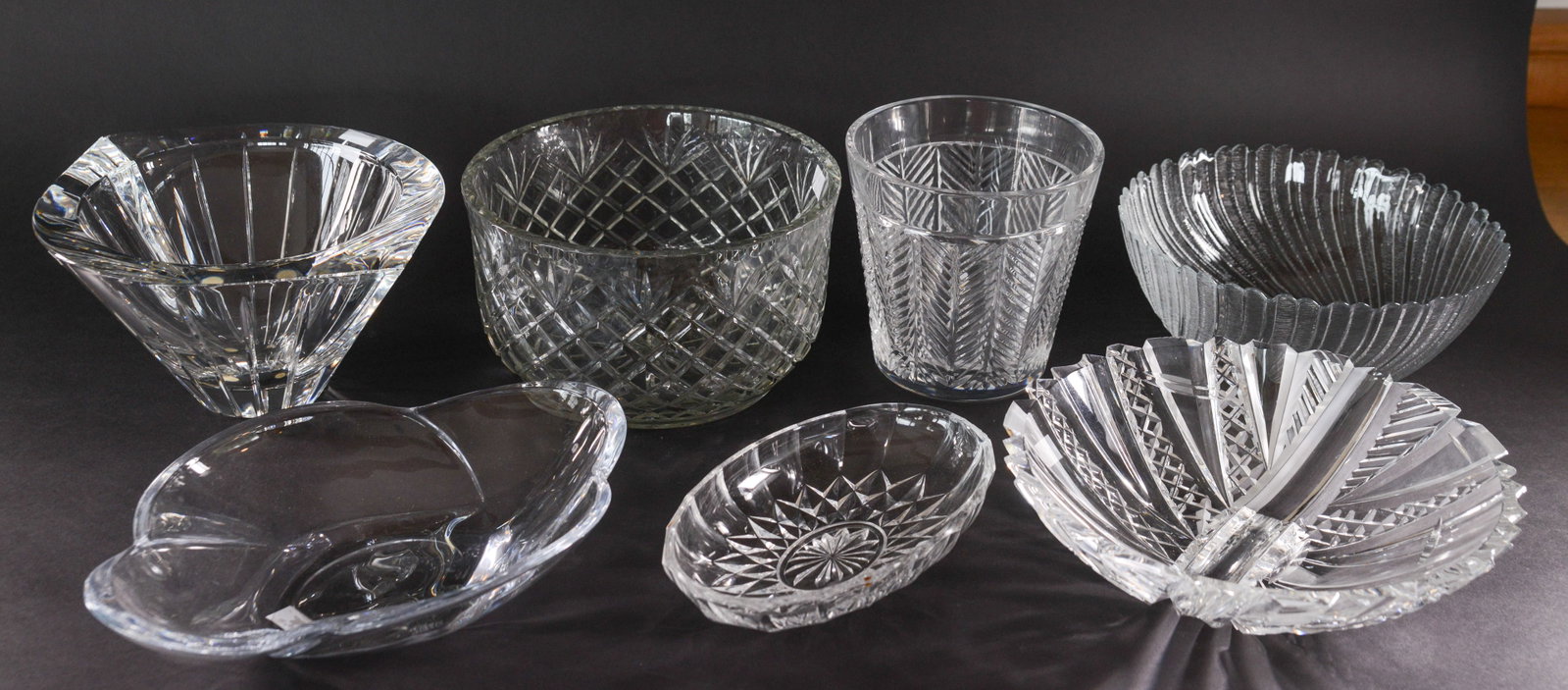 Six Crystal Bowls and a Vase.: Diameter of largest bowl 10 inches. A few small chips.