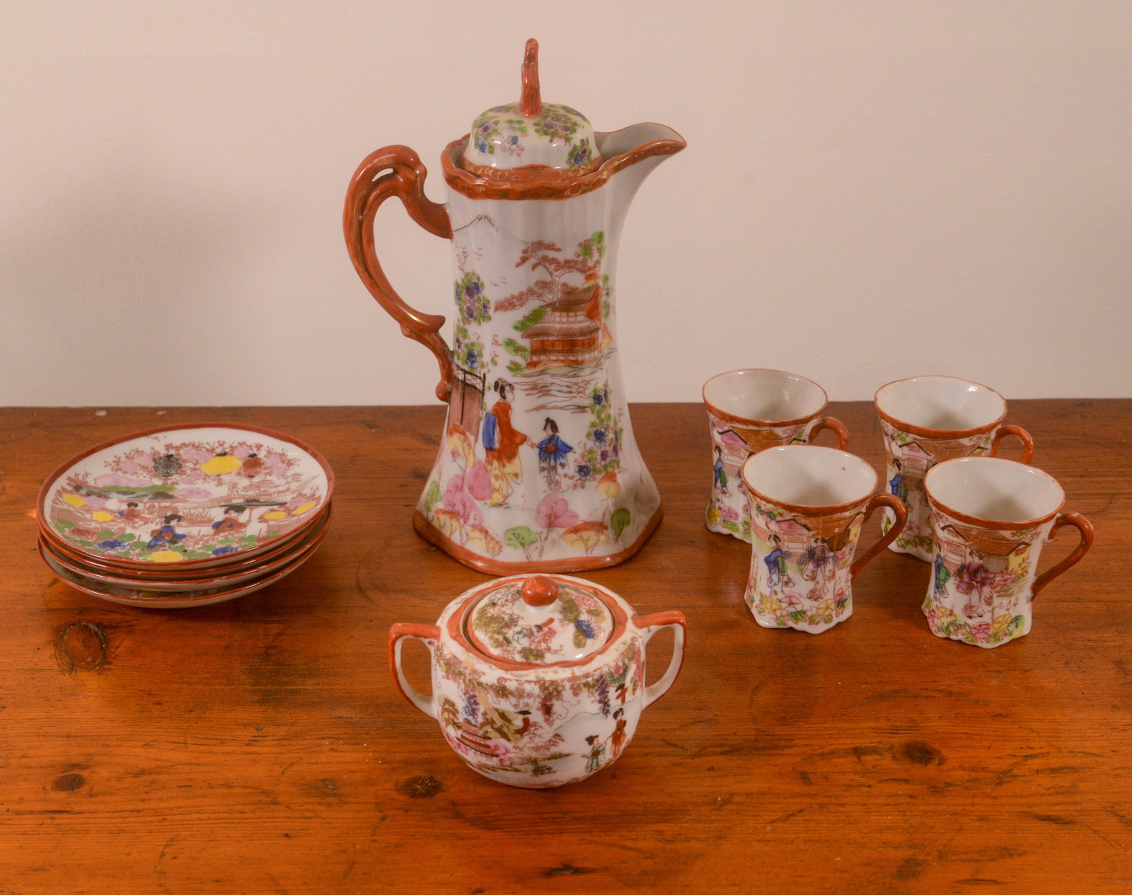 Japanese Porcelain Tea Set.: Coffeepot, height 9 inches, sugar bowl, and 4 cups and saucers.