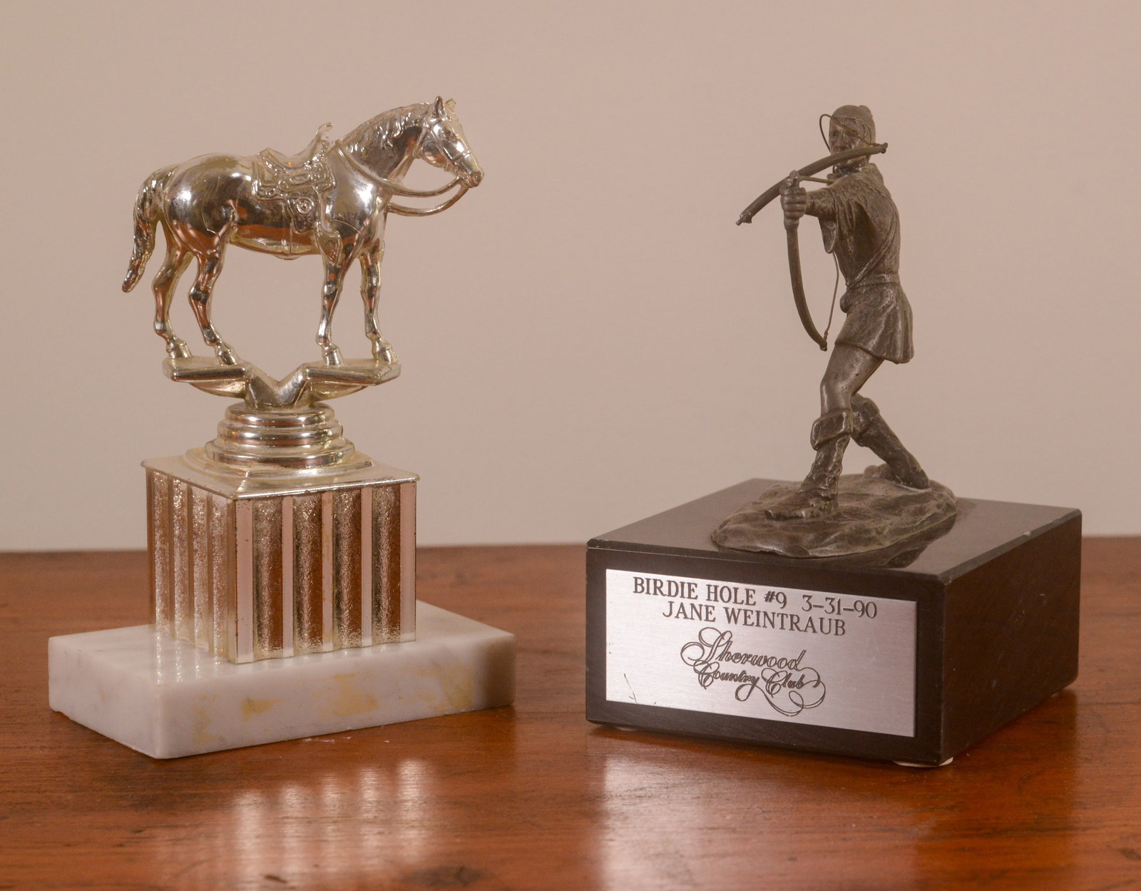 Jane Weintraub Birdie Hole Trophy, 1990.: Height 7 inches, together with another trophy.