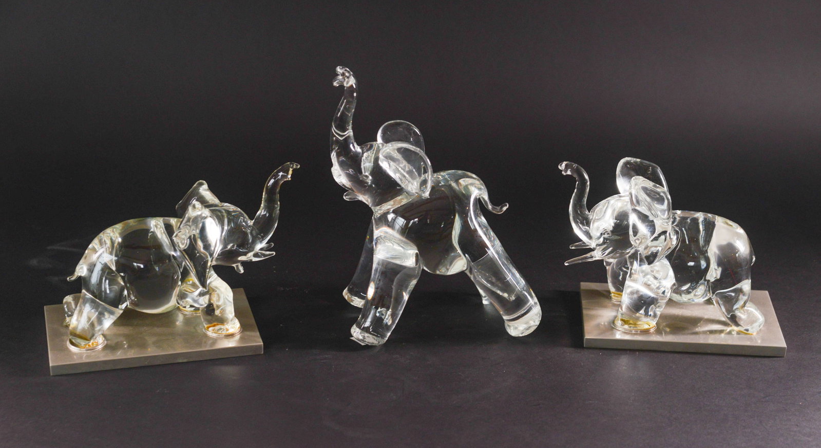 Three Crystal Elephants.: Lengths 6 and 7 inches.