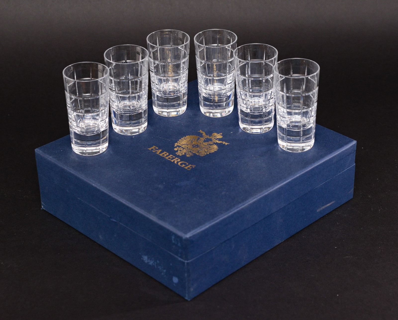 Six Faberge Atelier Crystal Glasses.: Height 4 inches, in original padded box.