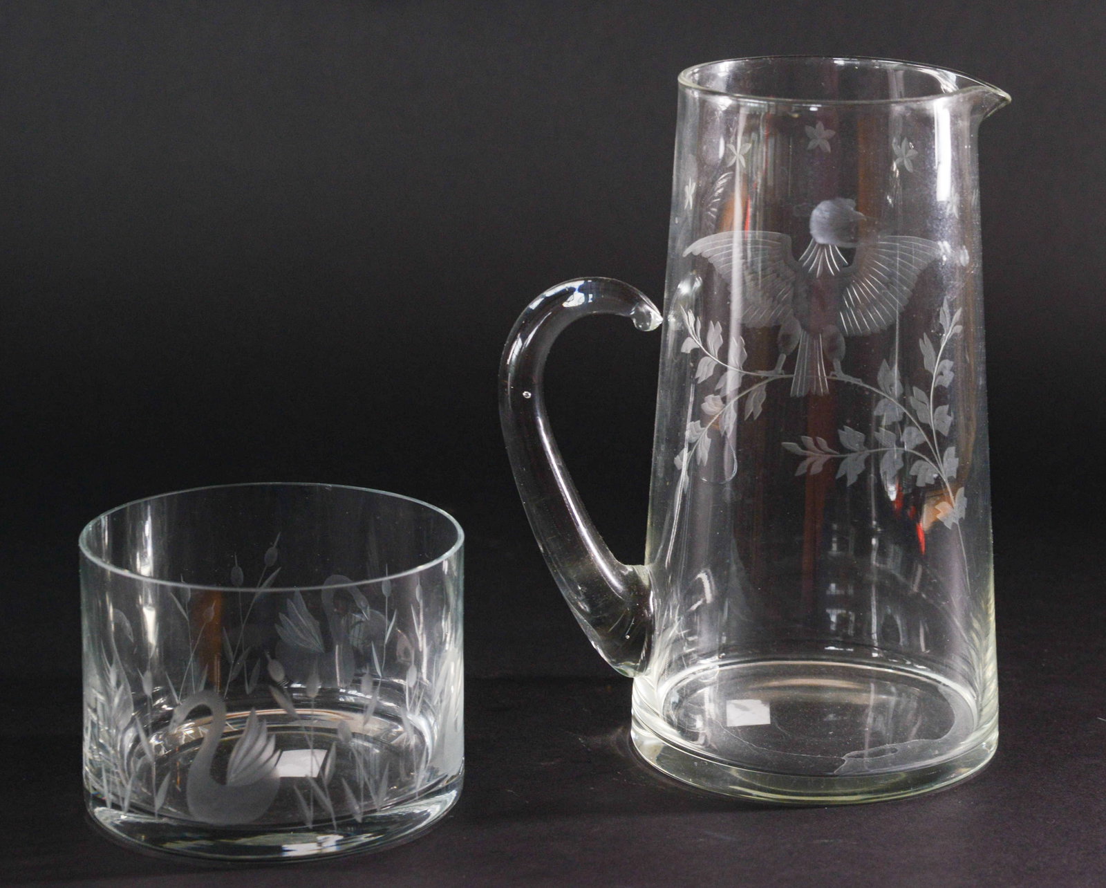 Two Etched Glass Pieces.: Pitcher with eagle, height 10 inches, and a bowl with swans. Good condition.
