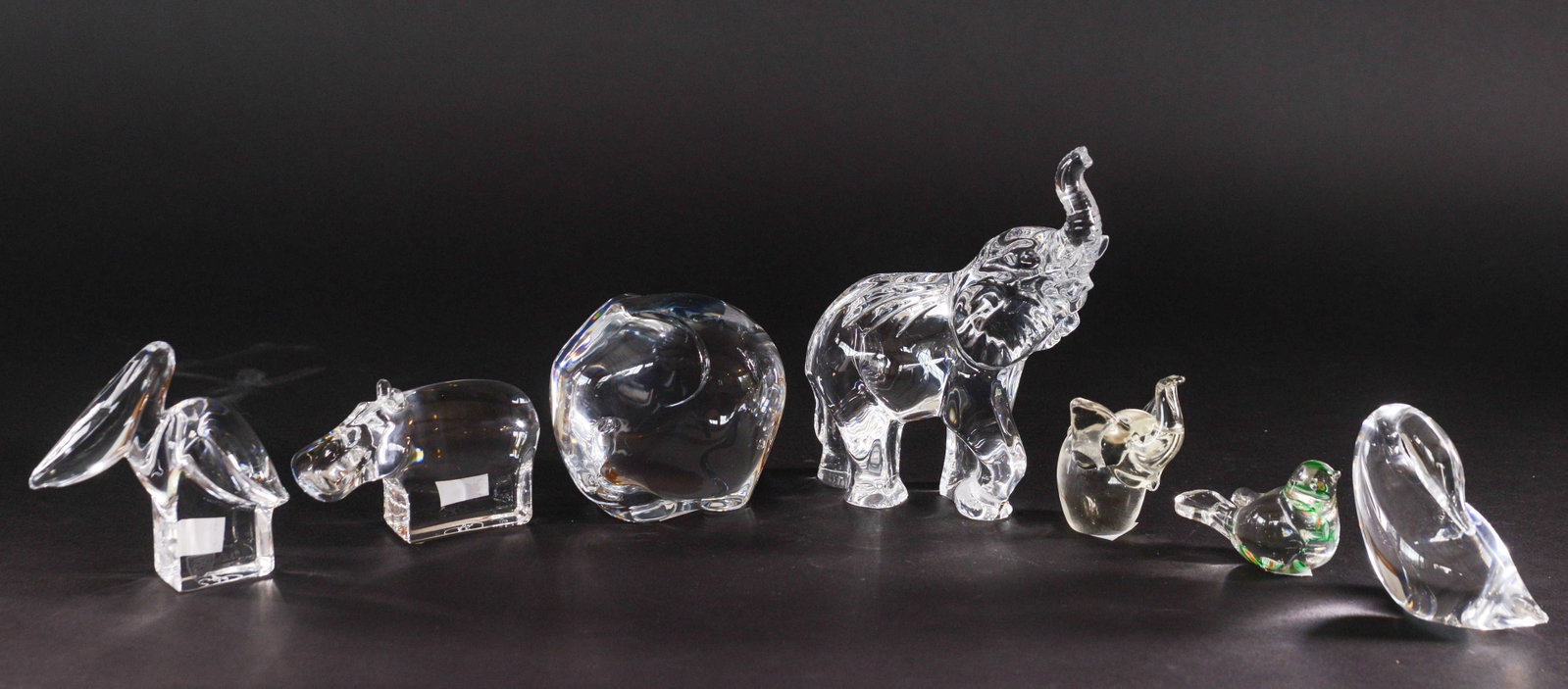 Seven Crystal Animals.: Tiffany & Co Bunny, length 5 inches, Orrefors pelican, Waterford elephant, Orrefors hippo, and three unmarked pieces.