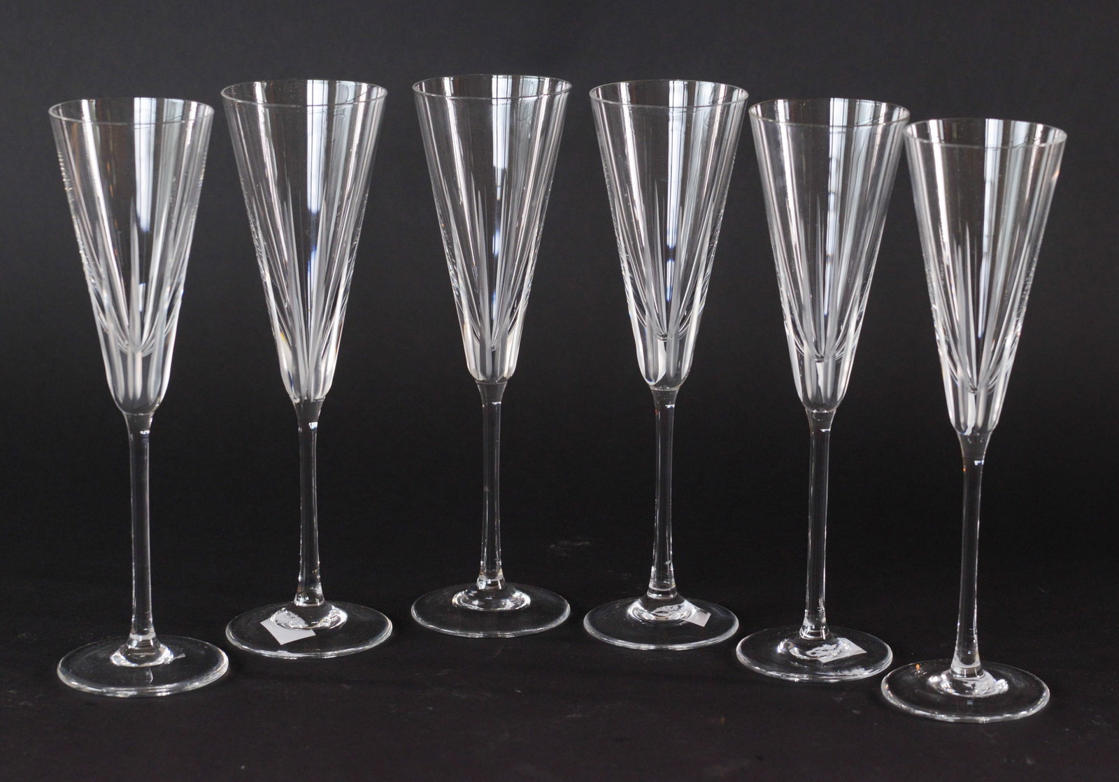 Six Crystal Champagne Flutes.: Height 10 inches.