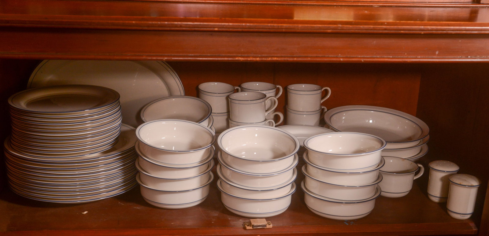 Group of Lenox Chinastone.: 11 dinner plates, 13 salad plates, 16 bowls, 12 cups and saucers, two serving bowls, salt and pepper.