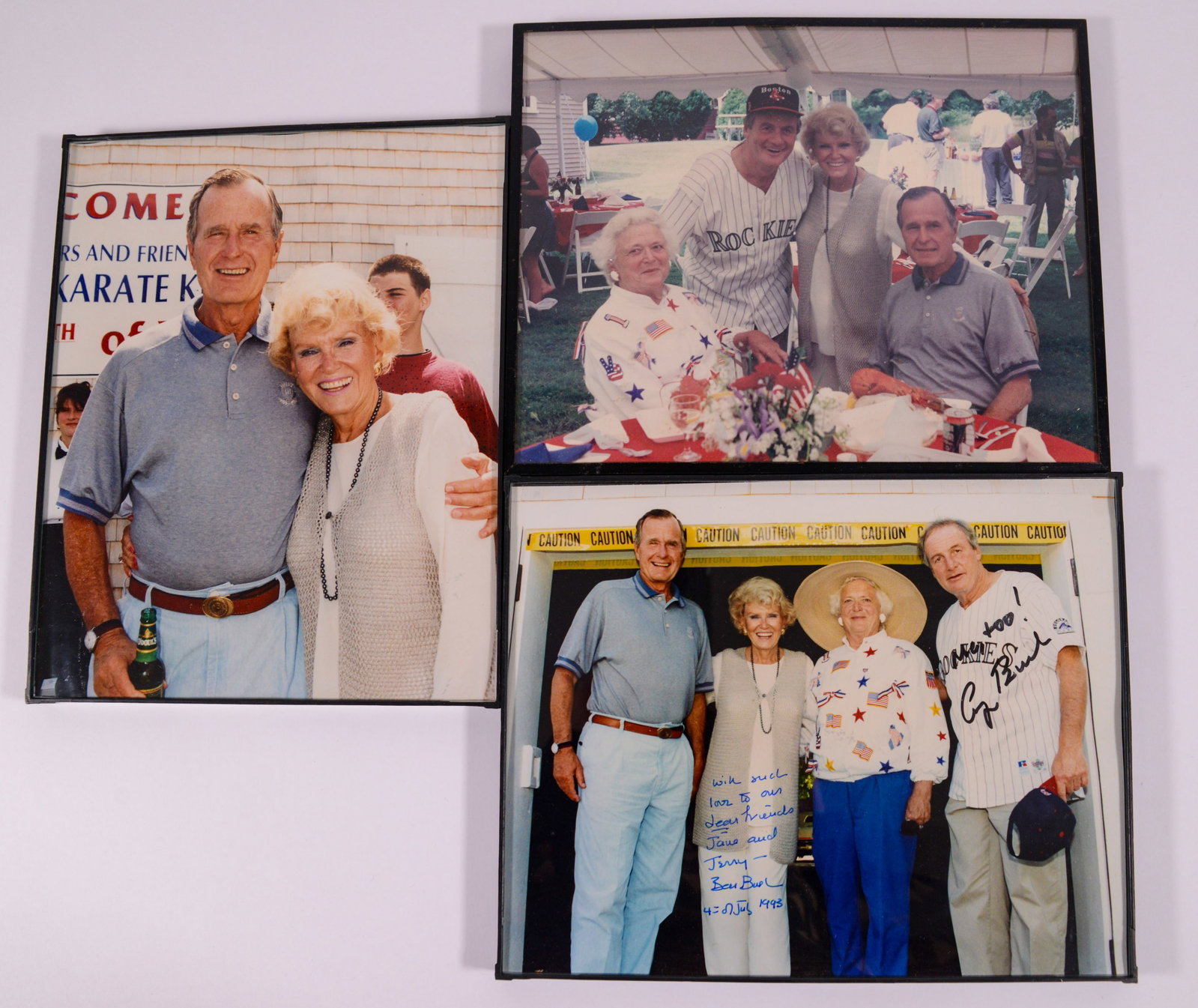 George H.W. Bush Signed Photograph.: George and Barbara Bush posing with Jerry and Jane Weintraub, 1993. 8x10 inches. With two other unsigned photographs.