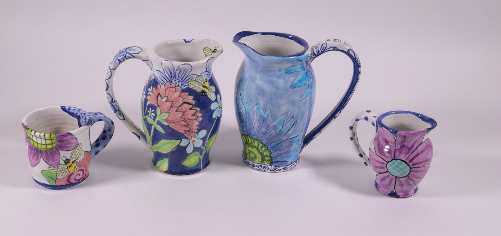 Three Damariscotta Pottery Pitchers and a Mug. (1 of 5)