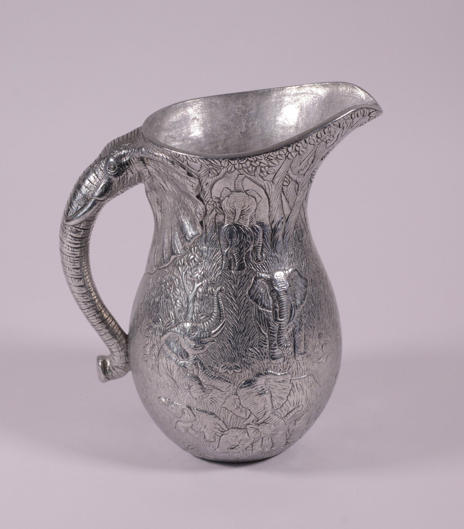 Pewter Pitcher With Elephants.: Height 10 inches.,