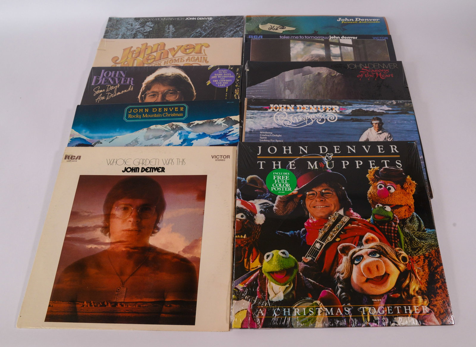 Ten John Denver Records.: Several in original shrink wrap. Jerry Weintraub signed John Denver in 1970, and was the driving force behind his commercial success.